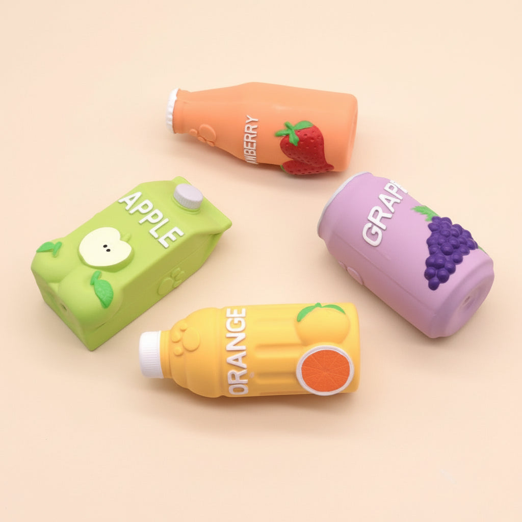 Four colorful juice box-shaped containers on a beige background